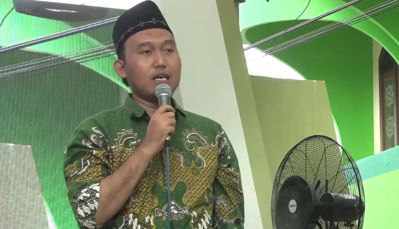 Ketua Tanfidziyah MWCNU Bungah KH Muhammad Alauddin saat menyampaikan sambutan serta progres kegiatan MWCNU Bungah. Foto: tangkapan layar youtube MWC NU Bungah/NUGres