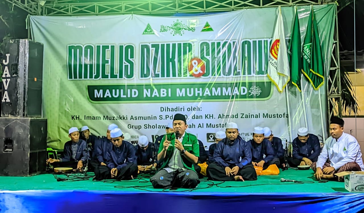 Ketua Pimpinan Anak Cabang Gerakan Pemuda Ansor Kedamean, Saiful Amri, saat memberikan sambutan. Foto: Zuhdi Yazid/NUGres