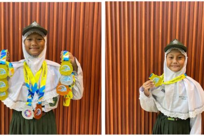 Dua bersaudari yang merupakan siswi MINU Trate Putri Gresik berhasil menorehkan prestasi dalam Kejurprov Jatim 2026, pada cabang olahraga akuatik. Foto: dok MINU Trate Putri Gresik/NUGres